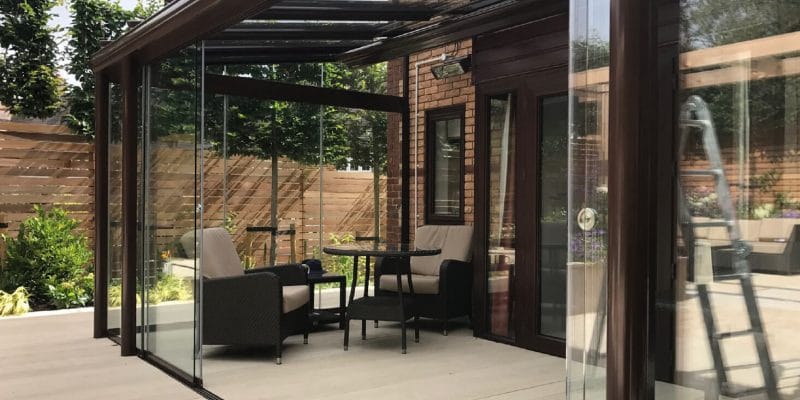 A contemporary glass room for outside dining
