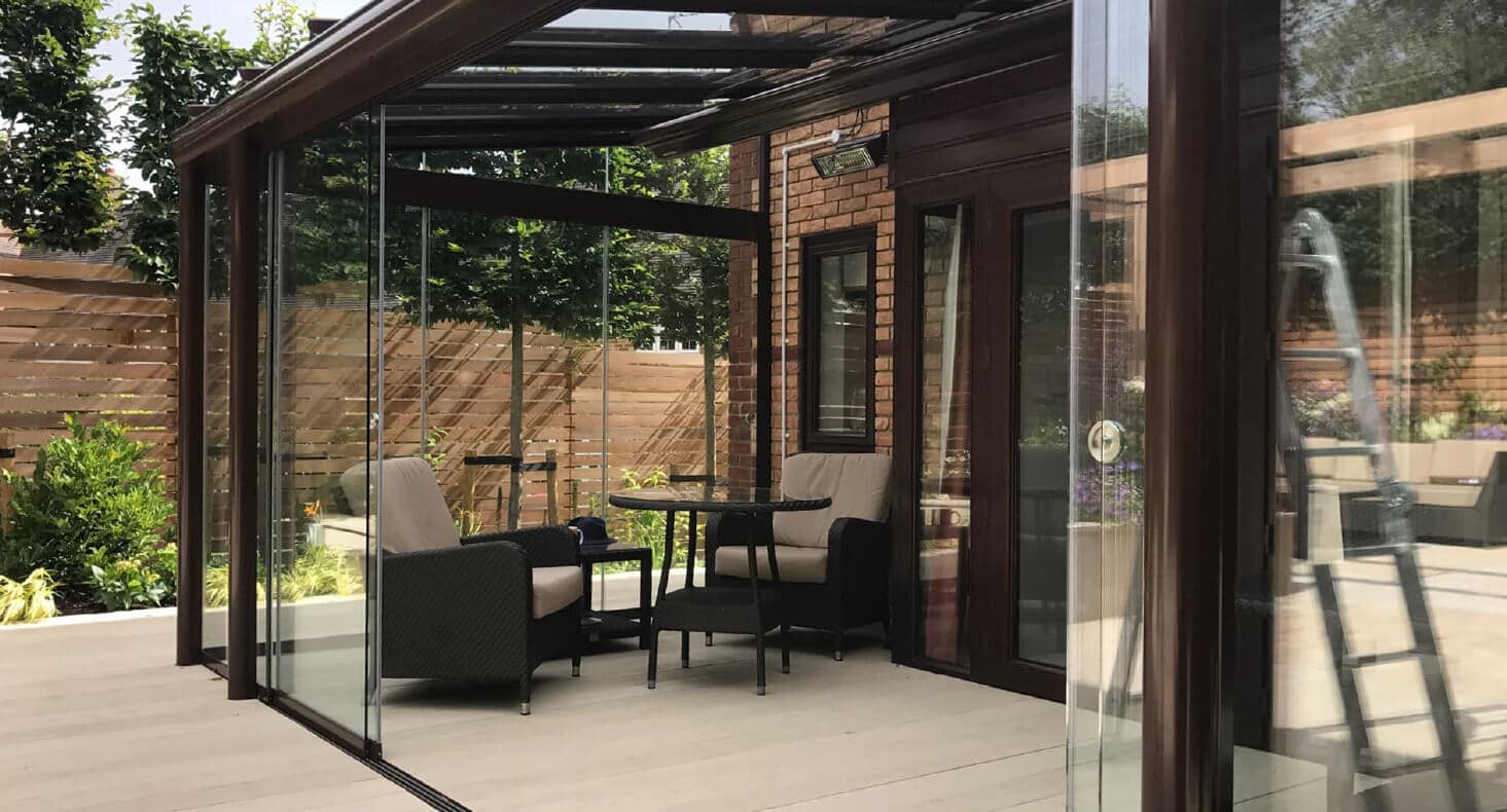 A contemporary glass room for outside dining